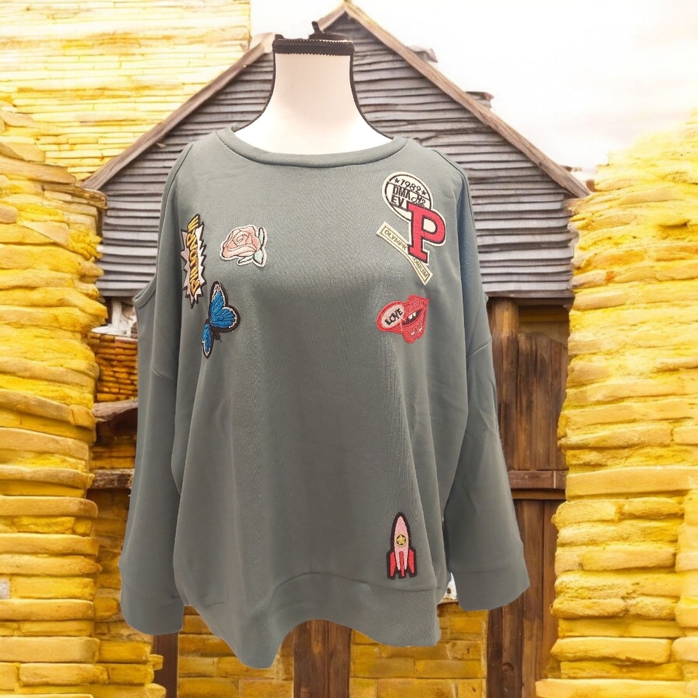 Playful Green Crew Neck Sweater with Embroidered Details